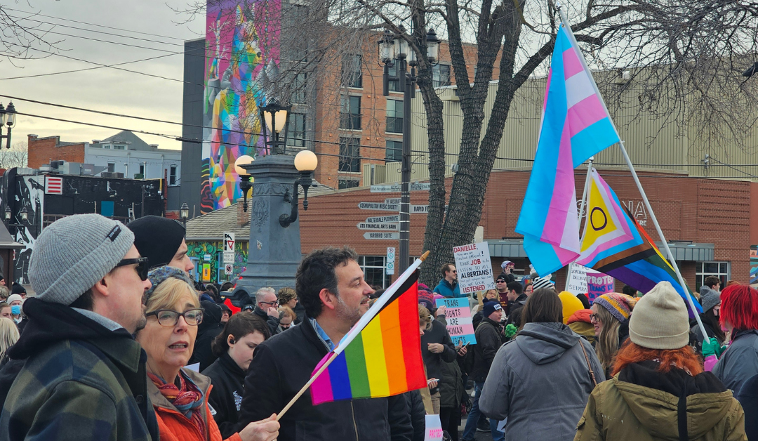 Edmontonians protest policy changes affecting trans youth with vibrant rally